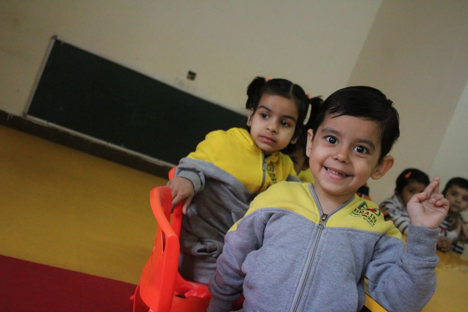 Young students smiling together during a classroom activity