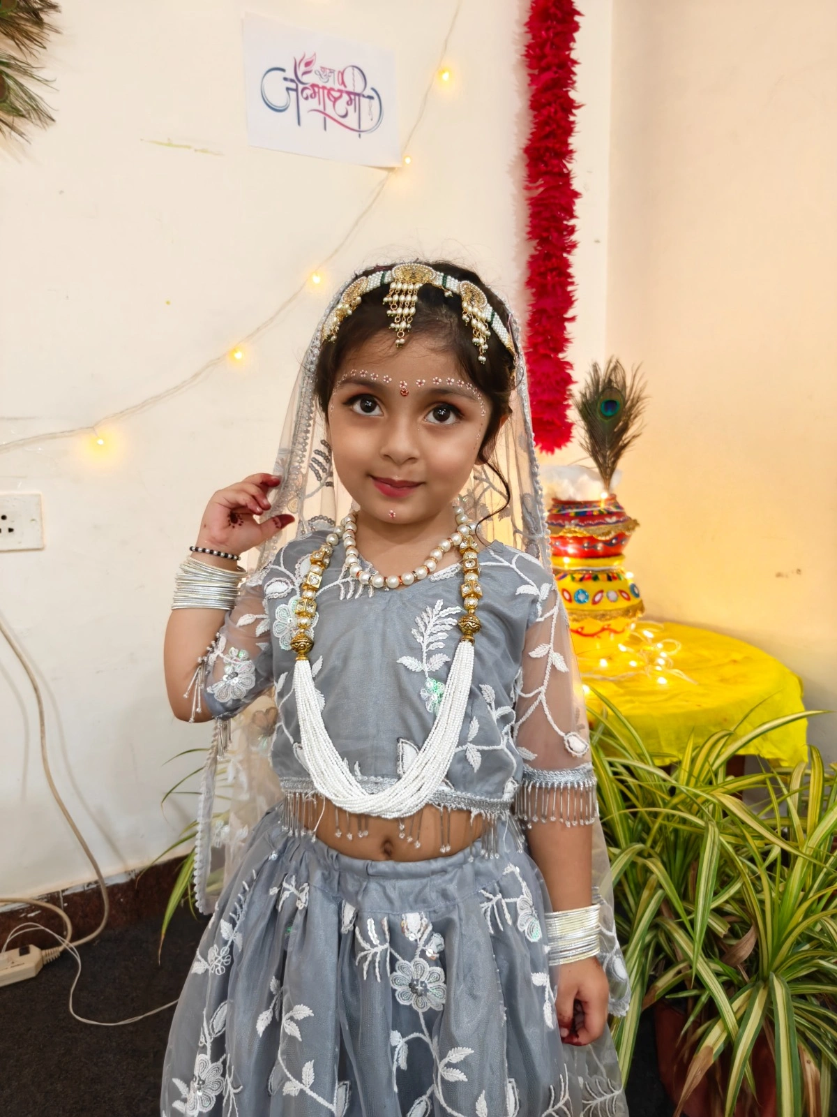 Students posing as Radha and Krishna during the celebration