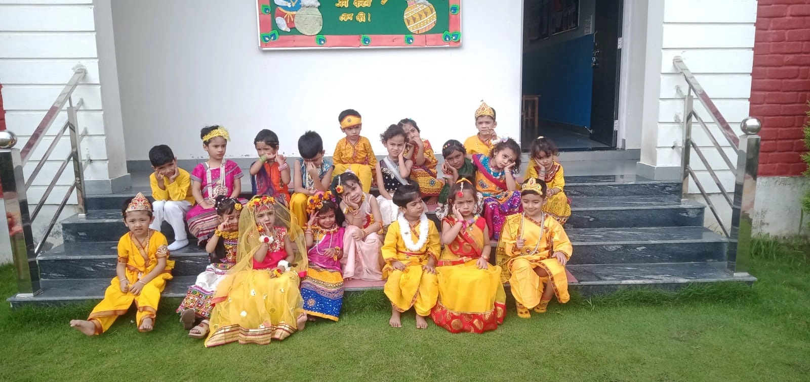 A group of students dressed for the school Janmashtami celebration