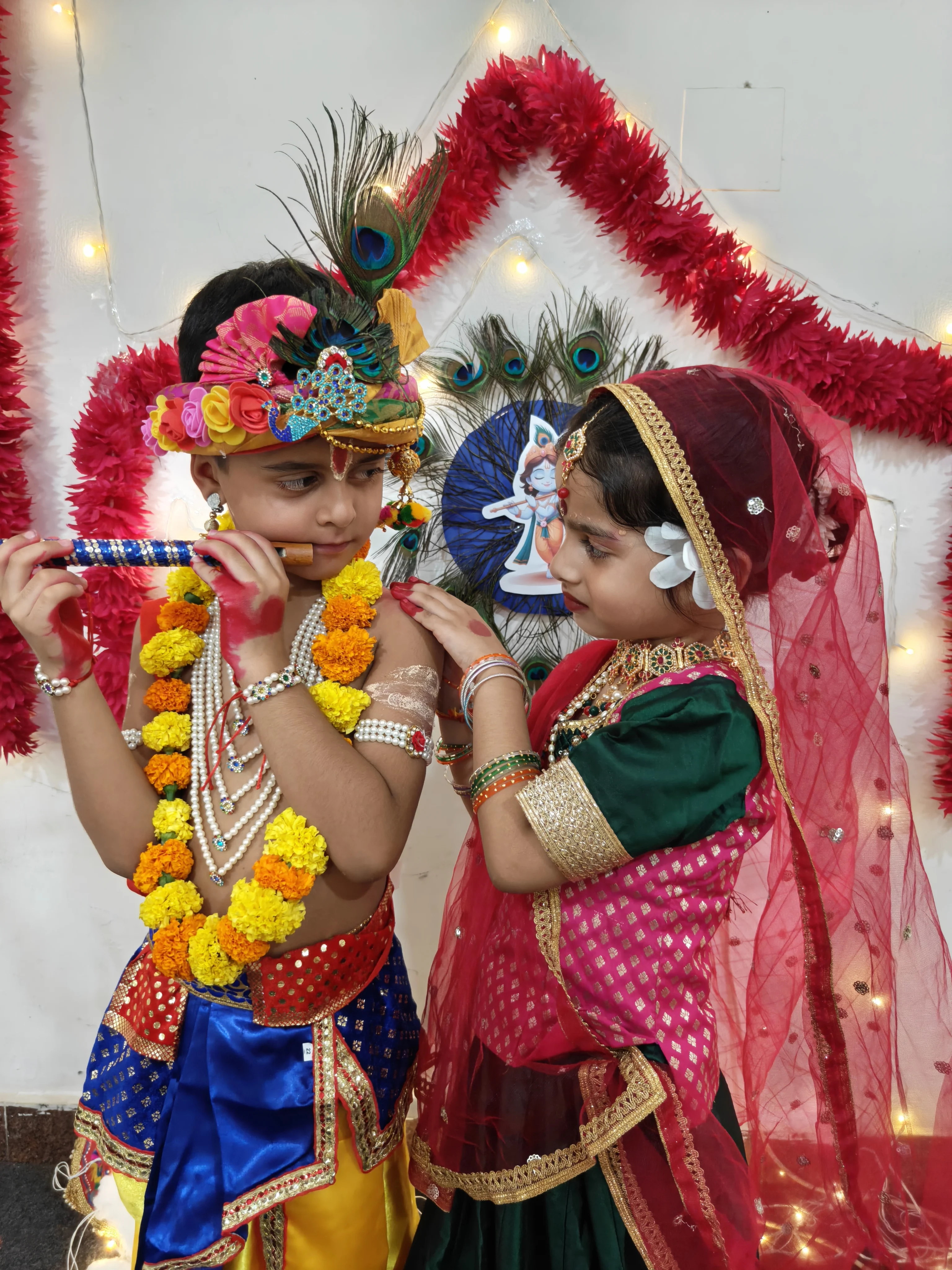 Young students dressed as Radha and Krishna for the Janmashtami celebration