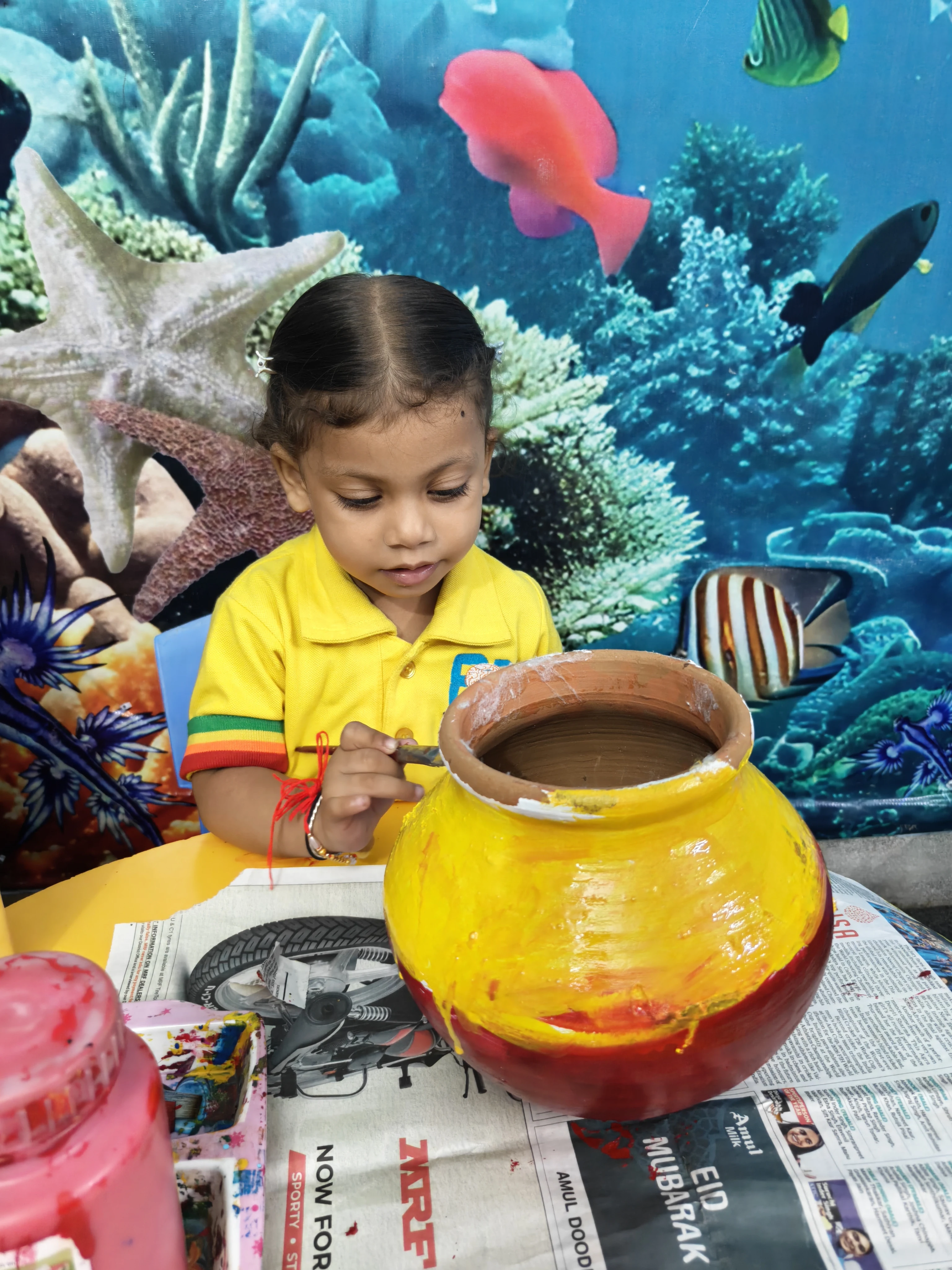 Students sharing a joyful Janmashtami celebration at school