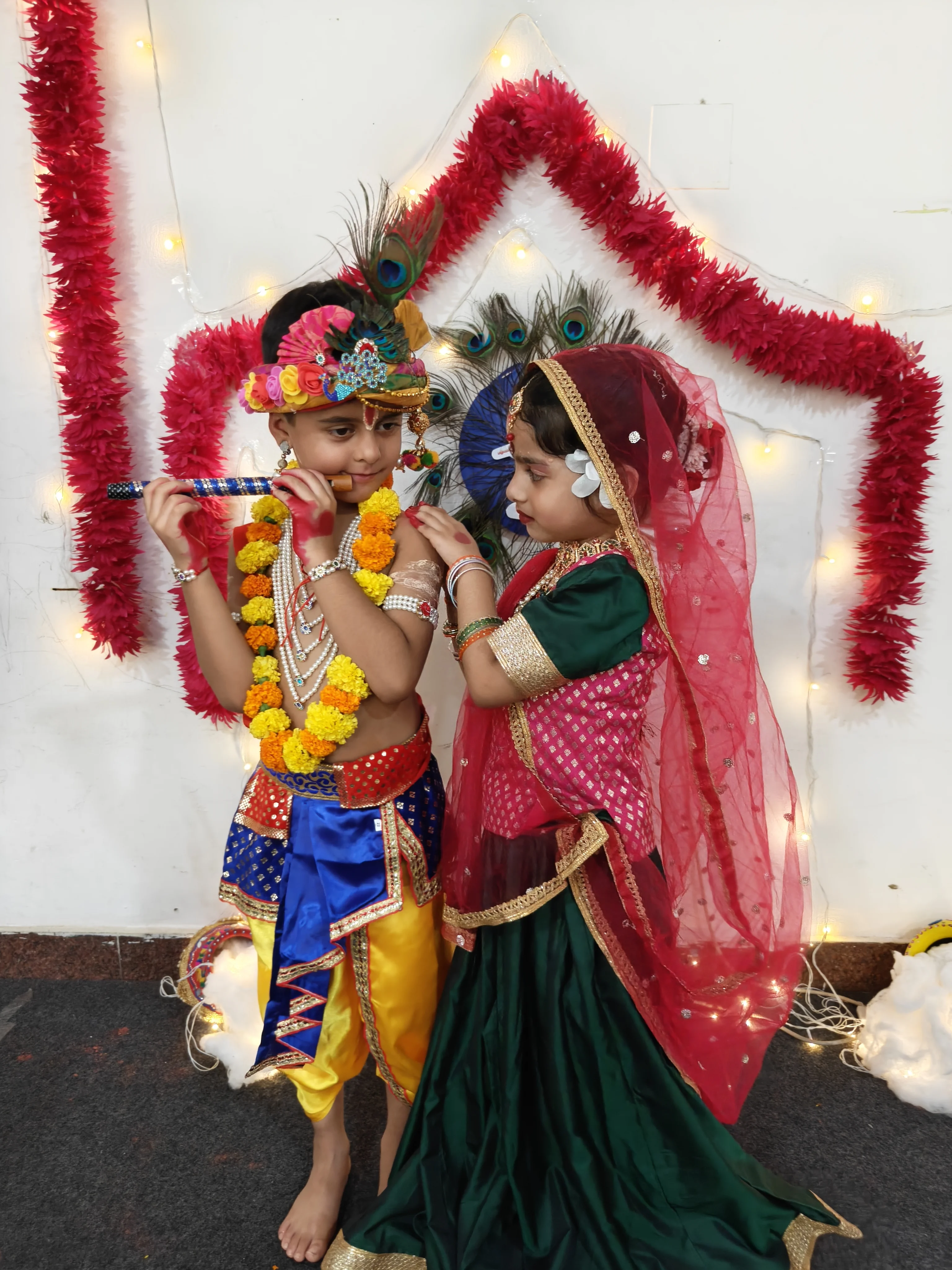 Students dressed in traditional attire for Janmashtami