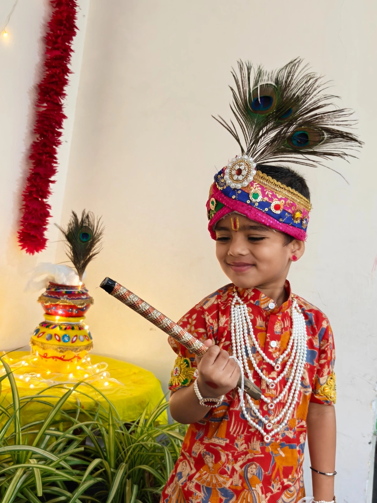 Young students smiling in their Janmashtami costumes