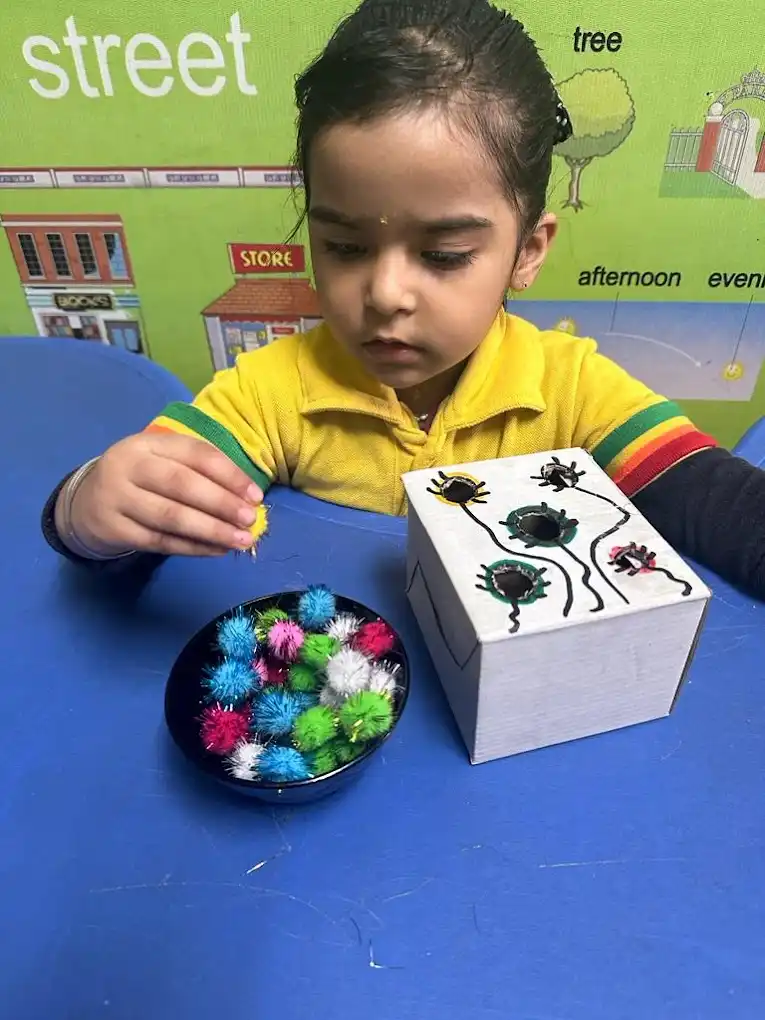 A student completing a hands-on classroom activity